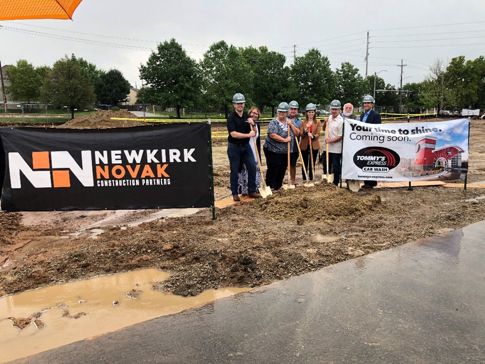 groundbreaking of tommy's express construction site with team members holding shovels